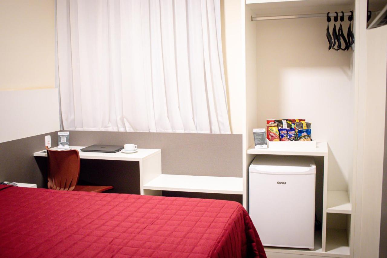 Hotel H2 Congonhas Congonhas  Esterno foto A typical room at a capsule hotel